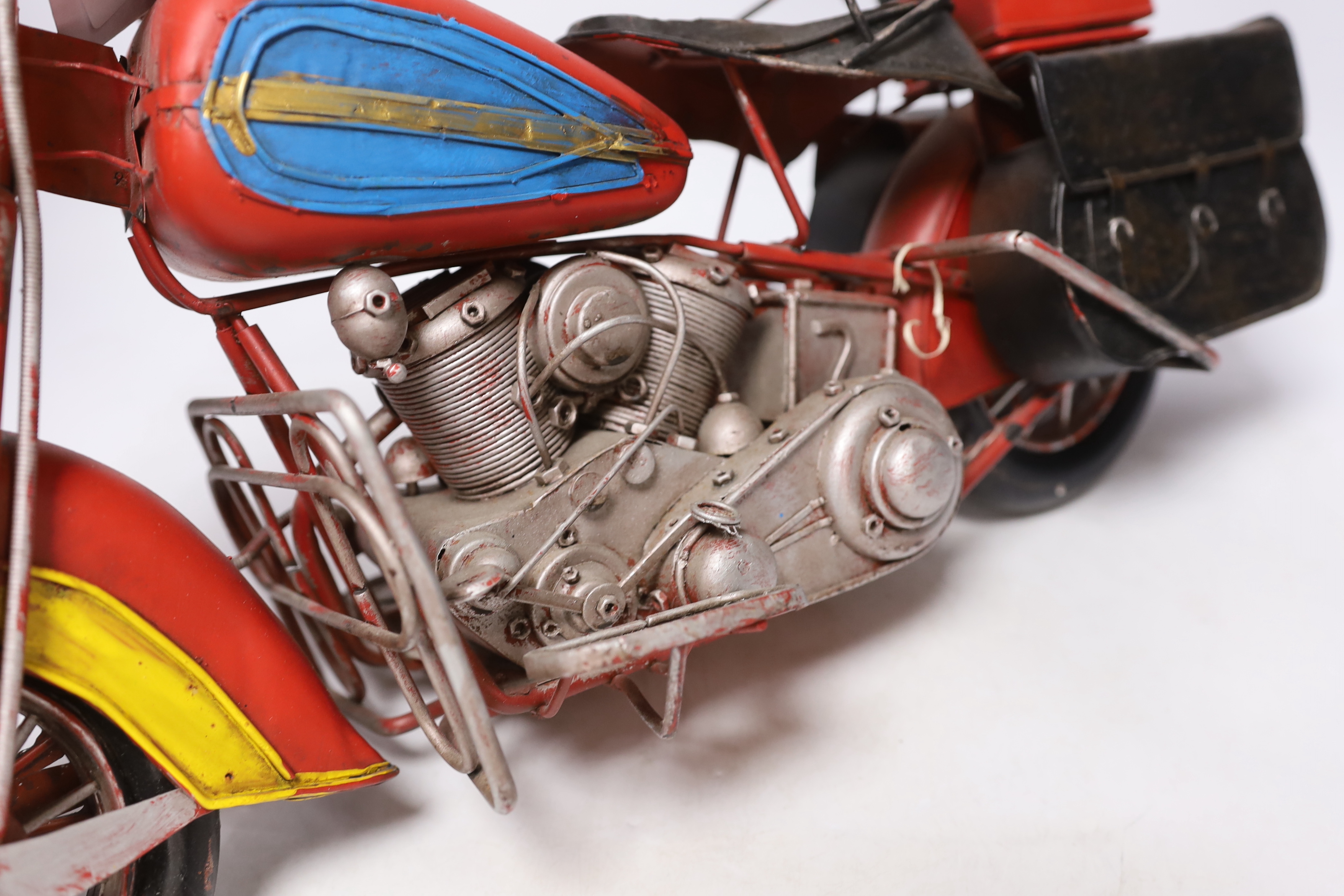 A faux tinplate motorcycle, 54cm long